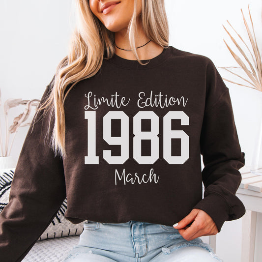 Vintage inspired green crewneck sweatshirt featuring bold 1986 numbers with special edition March text, designed for a 40th birthday milestone celebration.