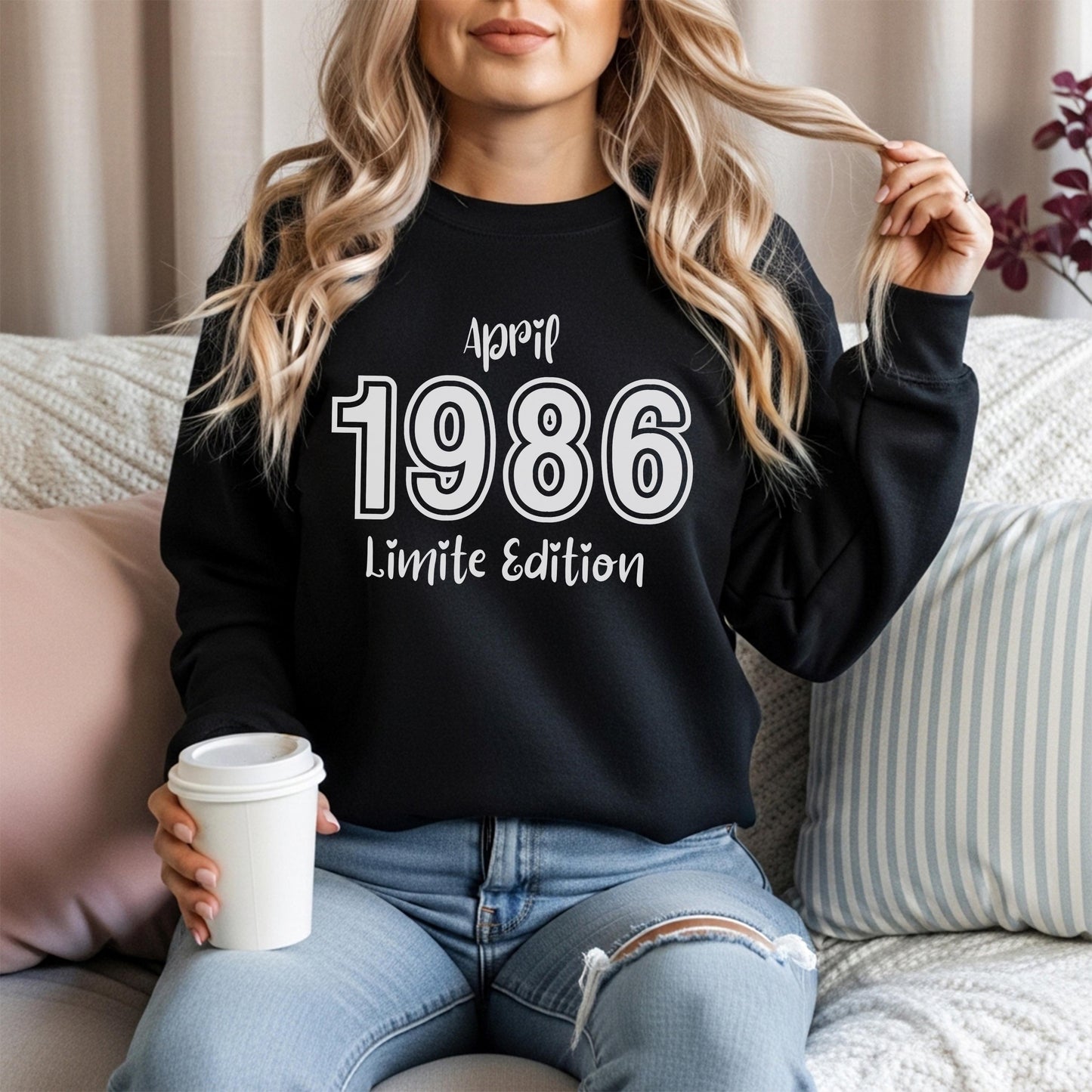 Folded green retro style sweatshirt with bold white 1986 print and special edition March text, vintage inspired birthday design for 40th milestone celebration.