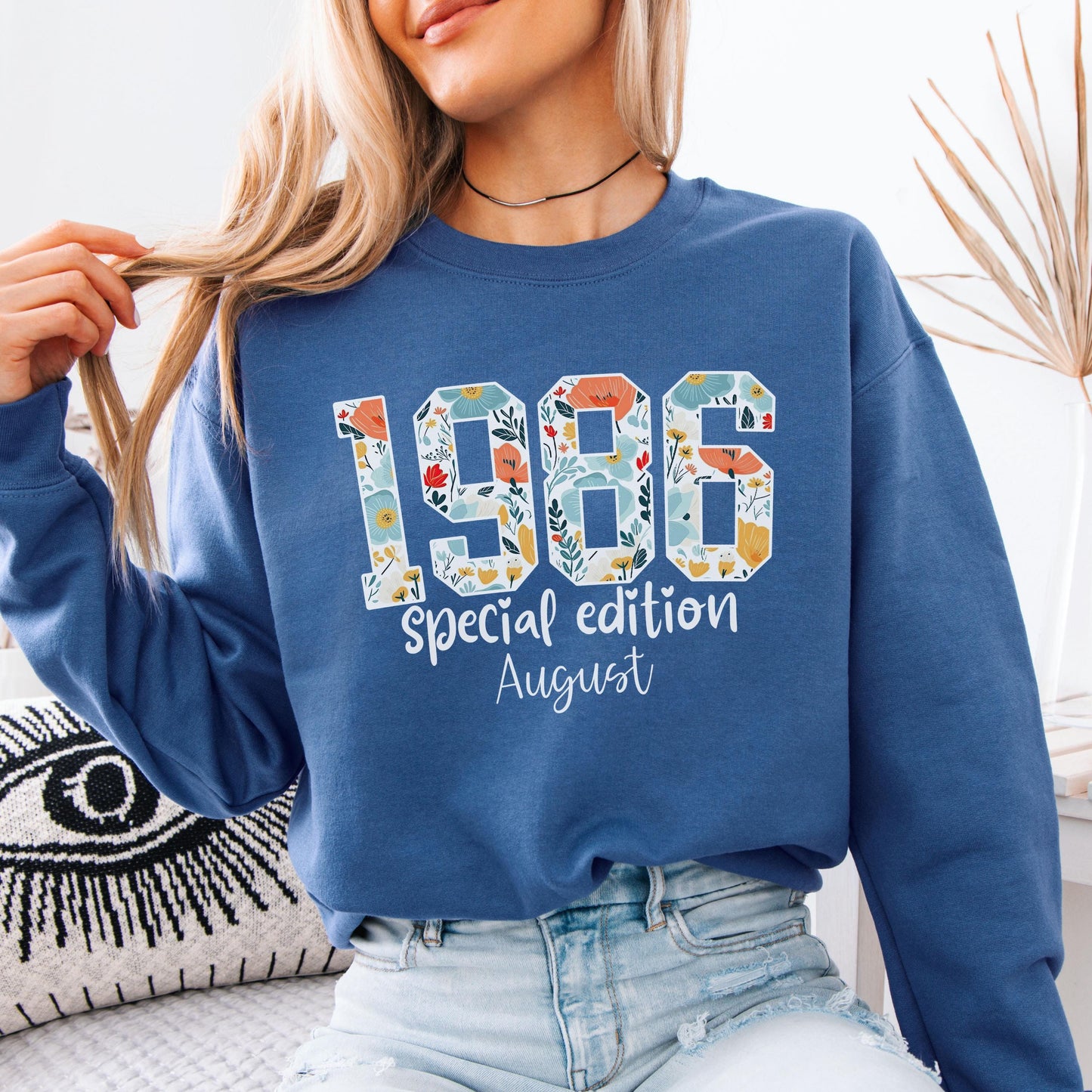 White crewneck sweatshirt featuring floral patterned 1986 numbers with special edition June text, feminine retro birthday design for a 40th milestone celebration.