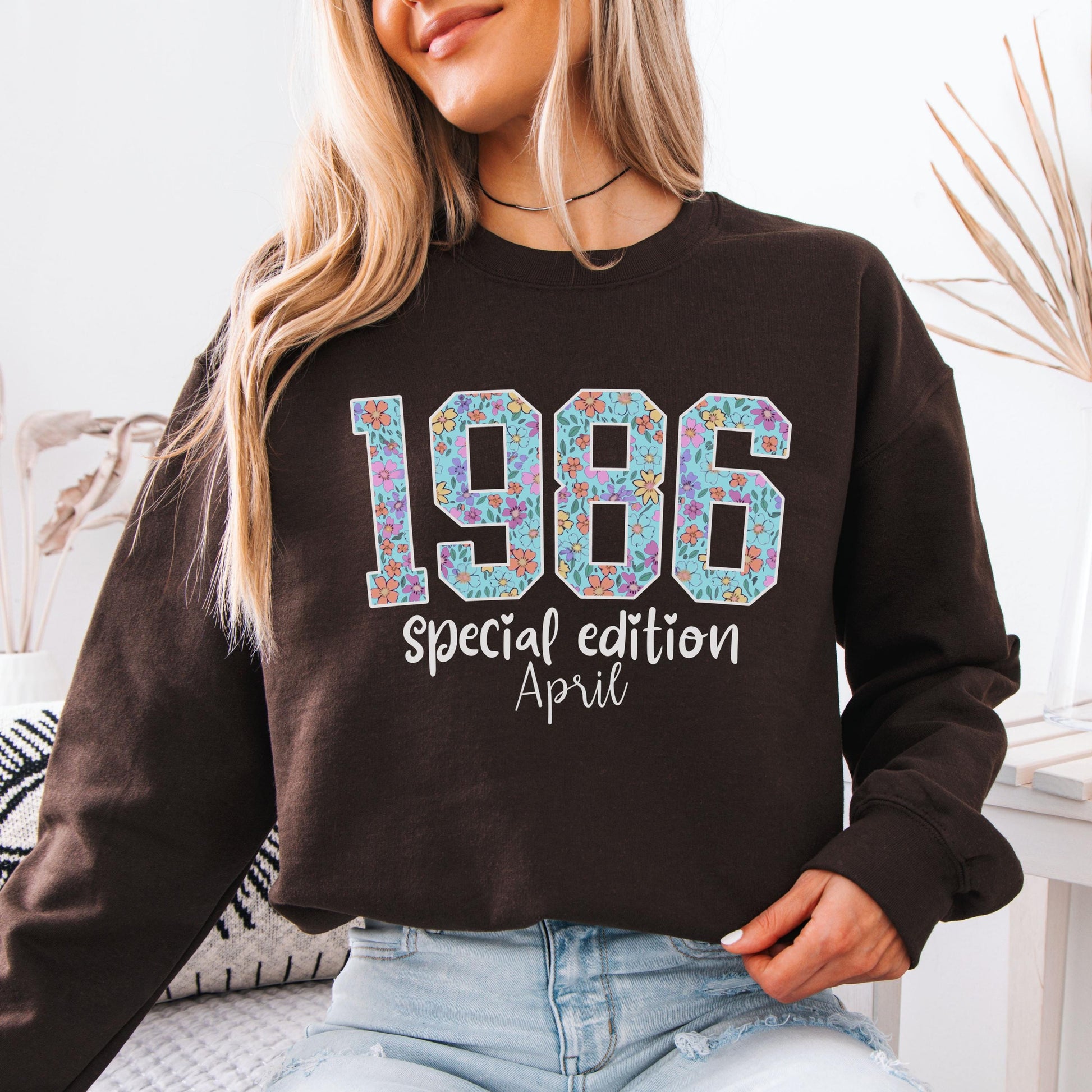 White crewneck sweatshirt featuring floral patterned 1986 numbers with special edition June text, feminine retro birthday design for a 40th milestone celebration.