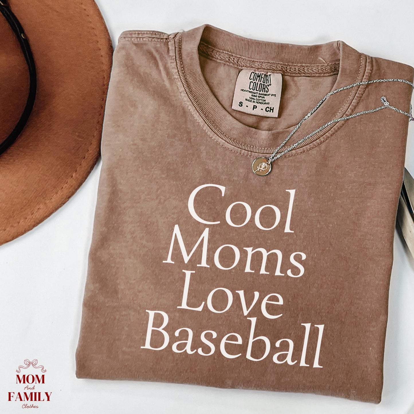 folded blue comfort colors® shirt with white text "Cool Moms Love Baseball", ideal for sporty moms or baseball game day outfits